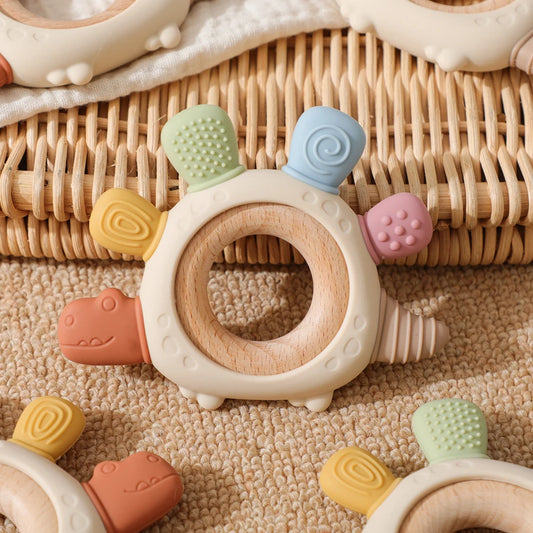 Dinosaurus siliconen bijtring met houten ring – veilig verzachten bij doorkomende tandjes