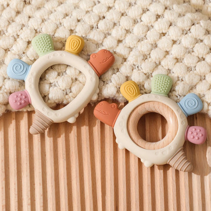 Anneau de dentition en silicone dinosaure avec anneau en bois – sûr et apaisant pour les bébés qui font leurs dents