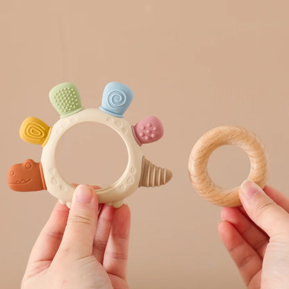 Anneau de dentition en silicone dinosaure avec anneau en bois – sûr et apaisant pour les bébés qui font leurs dents